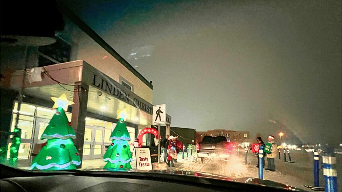 The friendly greeters at Let It Glow giving out treats as you go through their drive through Christmas Lights show