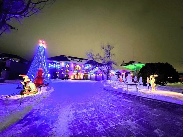 A fully decorated house with an LED Christmas Tree, singing snowmen and flashing lights.