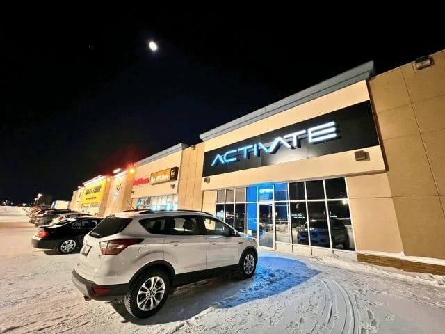 The outside storefront of Activate Games in Winnipeg during winter.