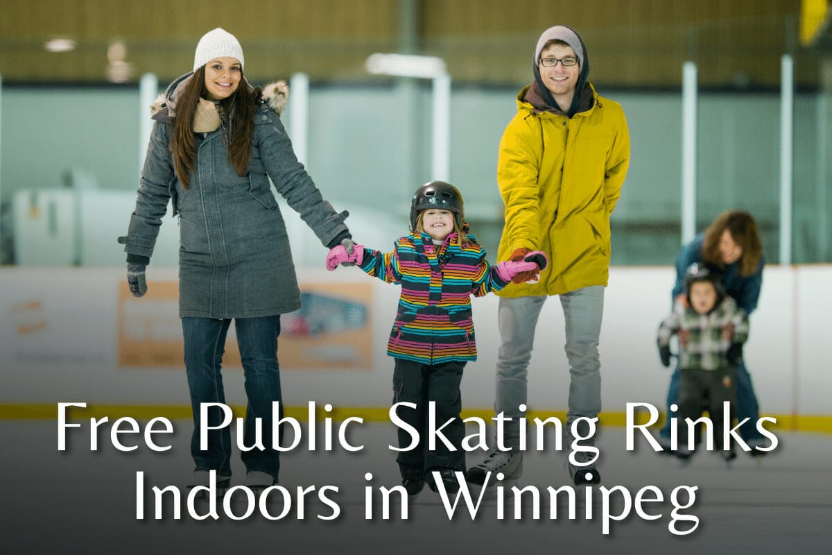 A young couple skating in an indoors rink with their child