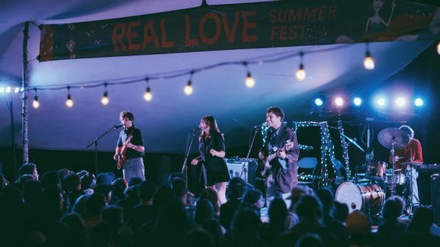 Live act playing on the stage of Real Love Summer Fest